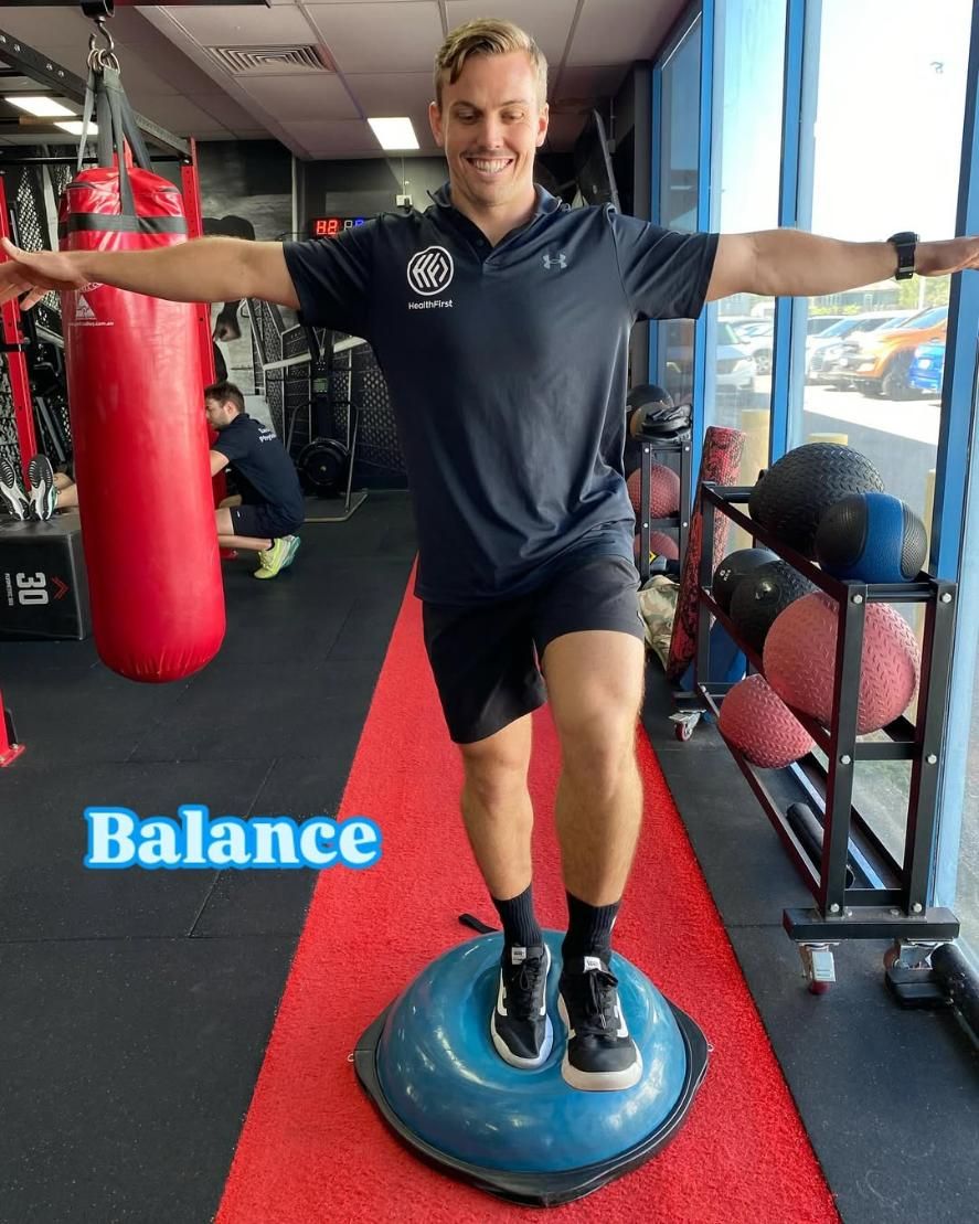 A Man is Sitting on a Machine in a Gym β Health First Townsville In Townsville, QLD
