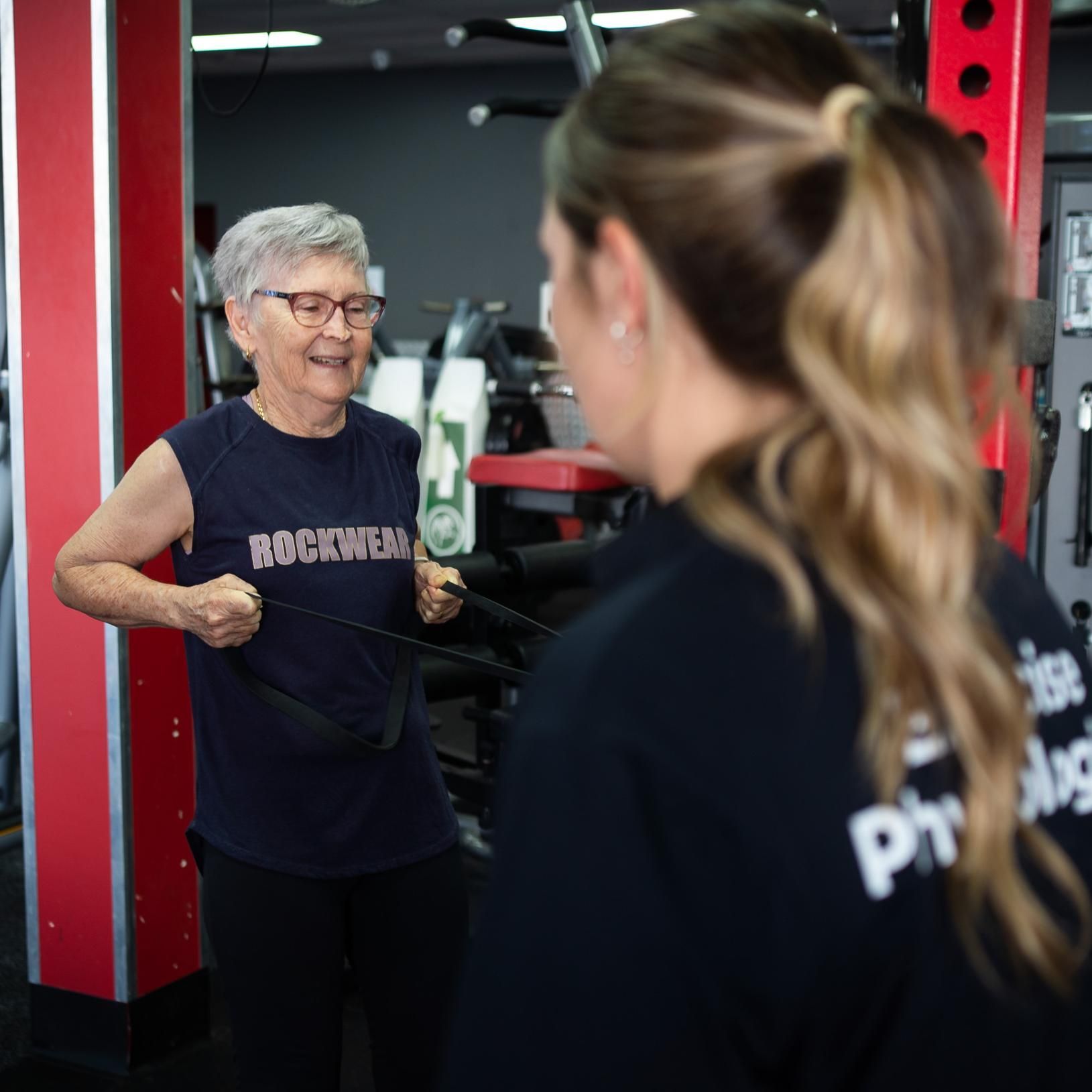 A Man is Sitting on a Machine in a Gym β Health First Townsville In Townsville, QLD