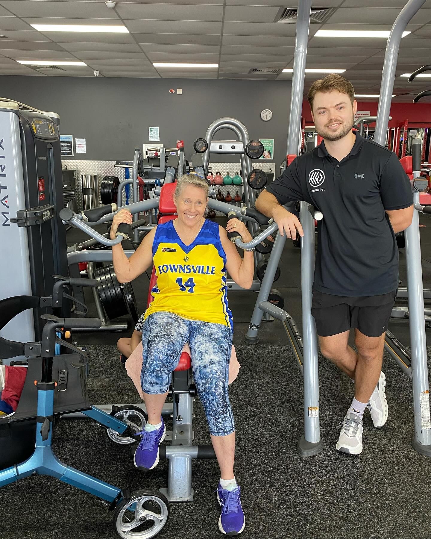 A Group Of People Are Sitting On The Floor In A Gym – Health First Townsville In Townsville, QLD