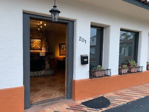 The front door of a house with the number 201 on it.