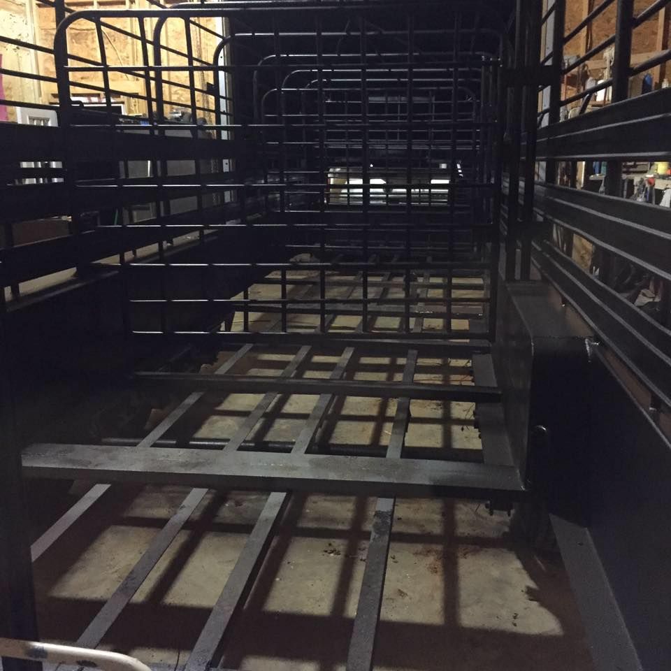 the inside of a trailer with a fence around it