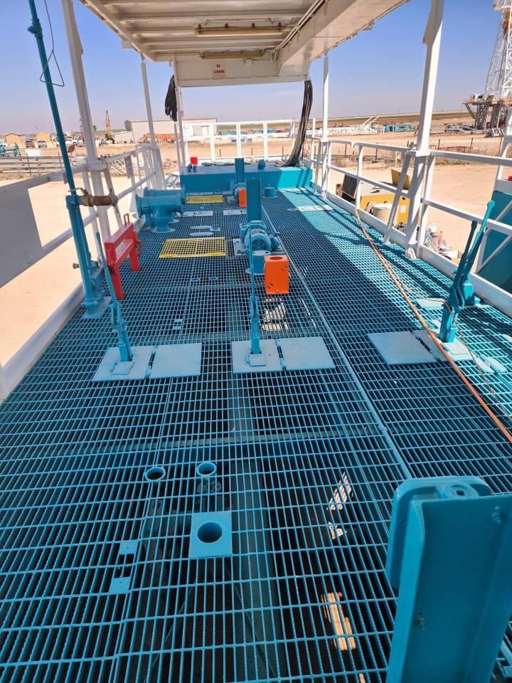 a boat with a blue deck and a white railing