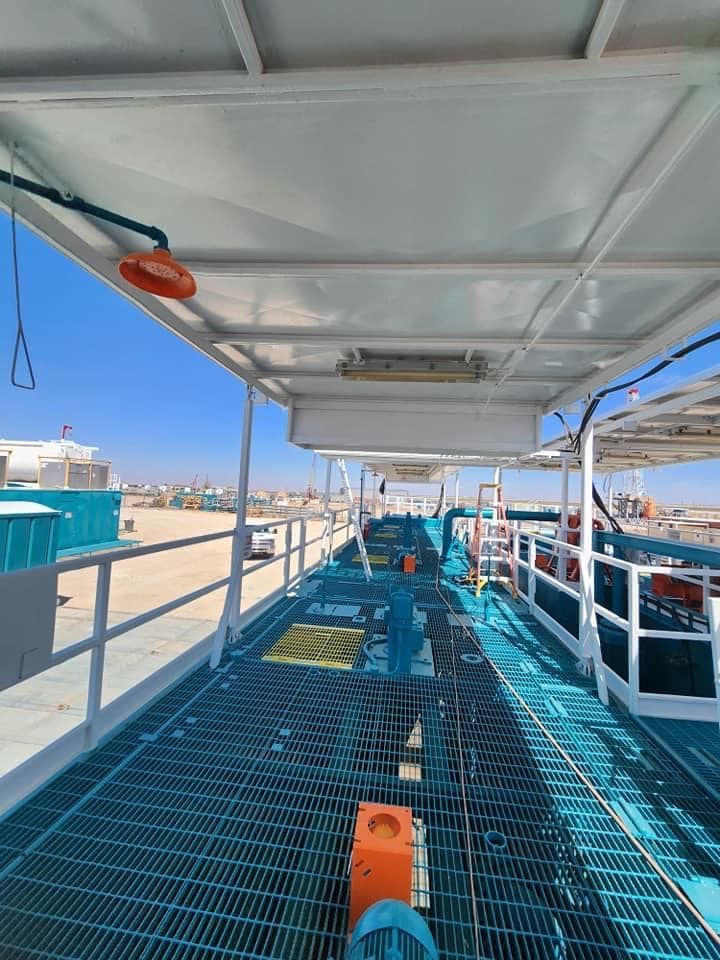 a boat with a blue deck and a white roof