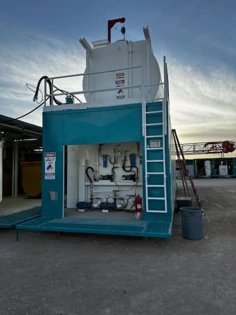 a blue and white building with a ladder on the side