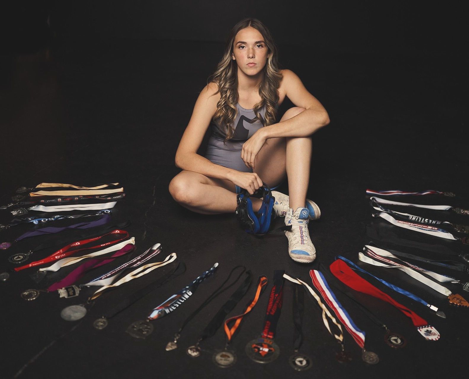 Adrianna Chronister displays some of her wrestling medals