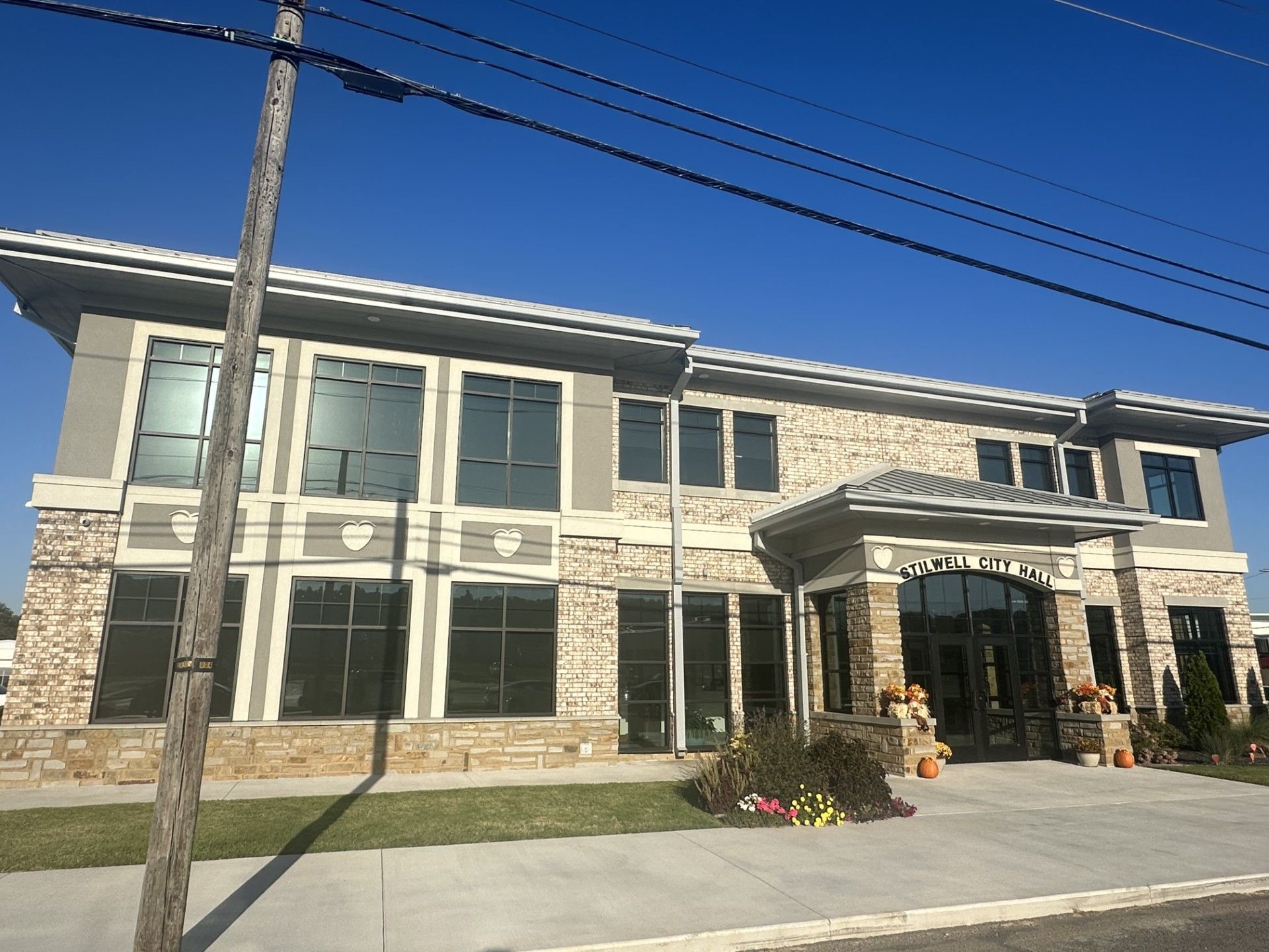 A large building with a lot of windows on a sunny day