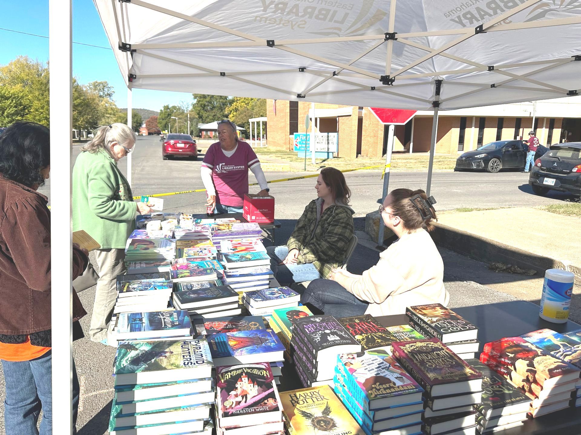 People looking at books at Fall Fest