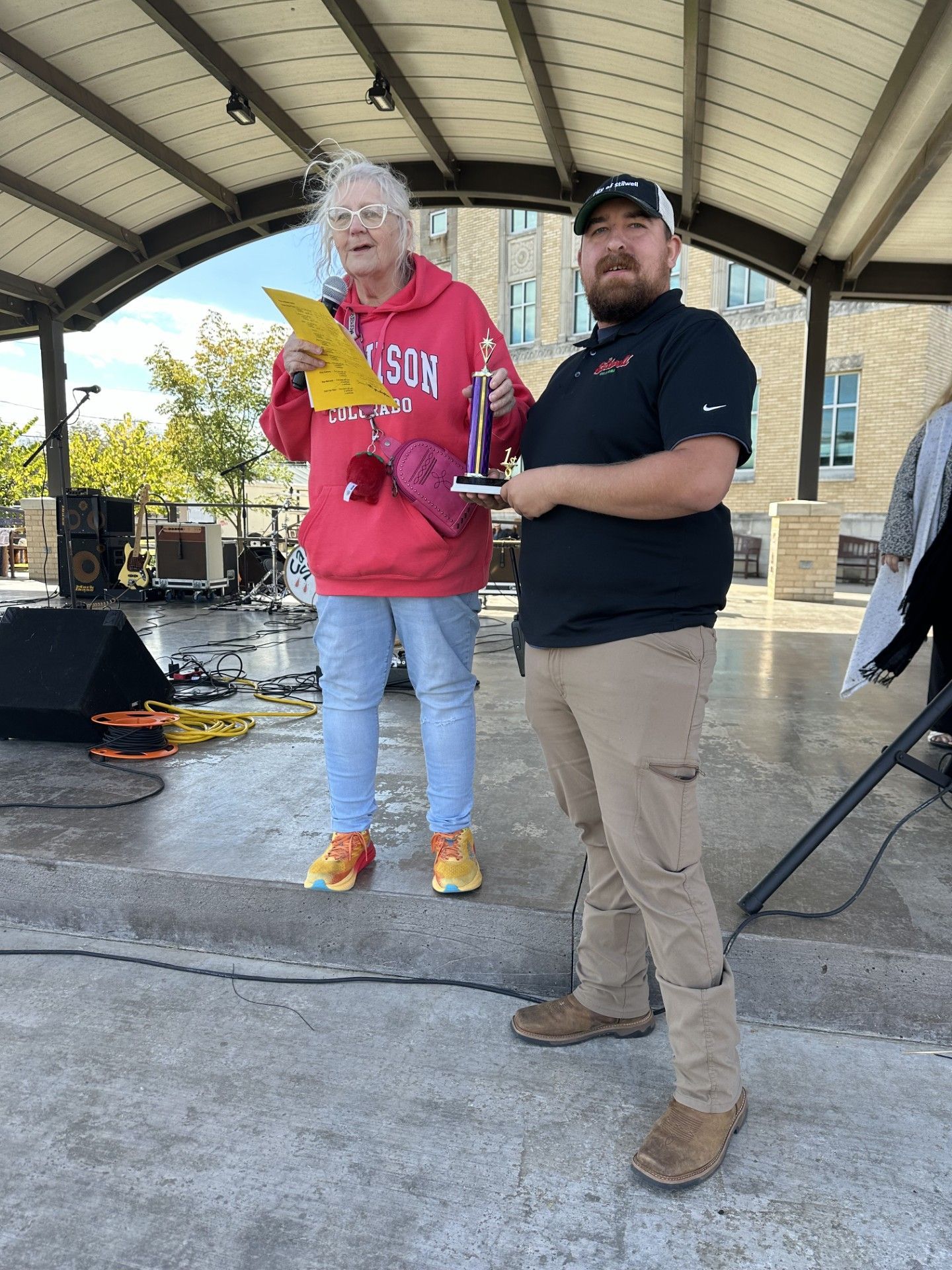 Mayor Jean Ann Wright presents an award to firefighter Tyler Rinehart
