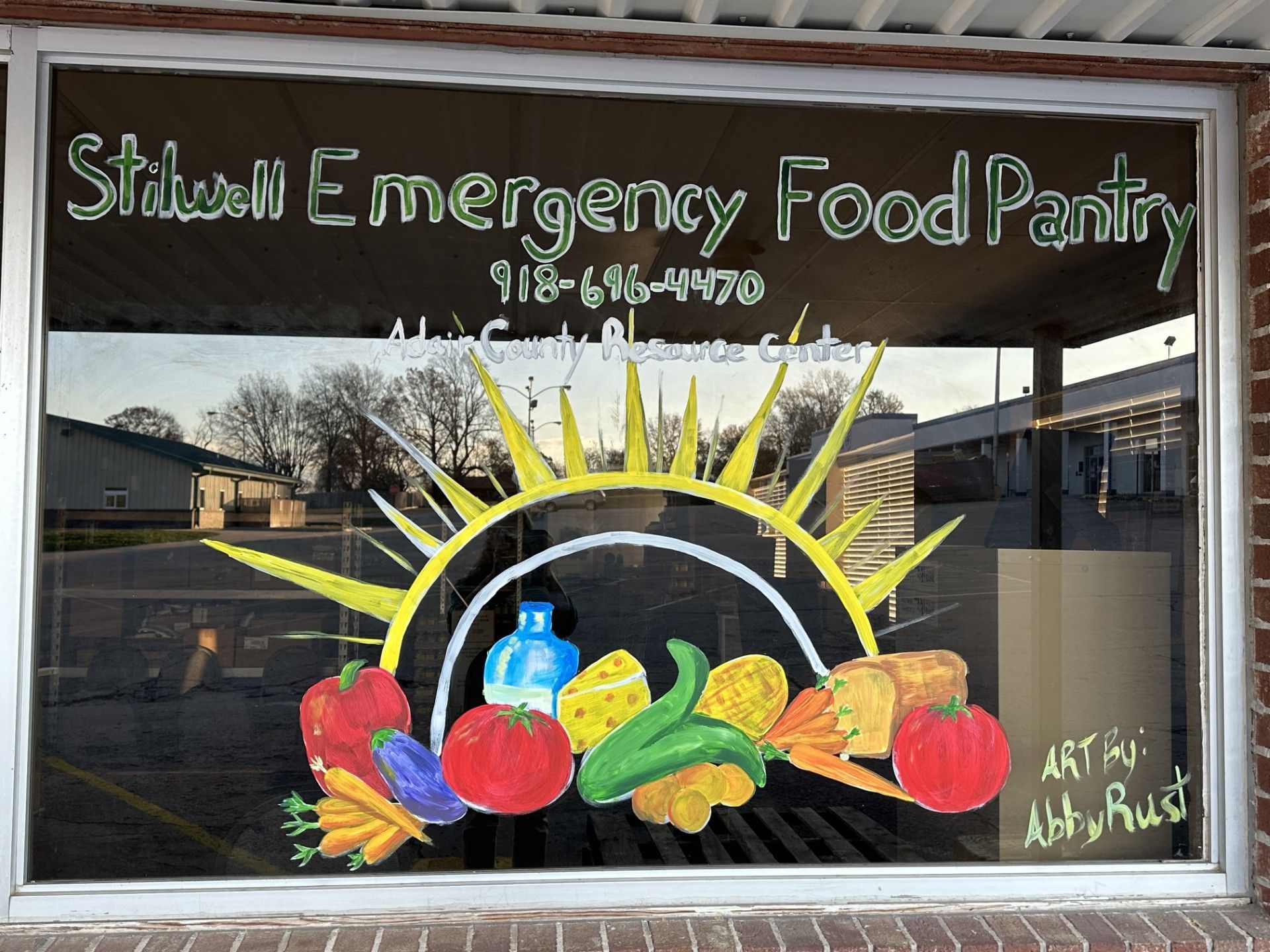 The newly painted store window at Stilwell Emergency Food Pantry