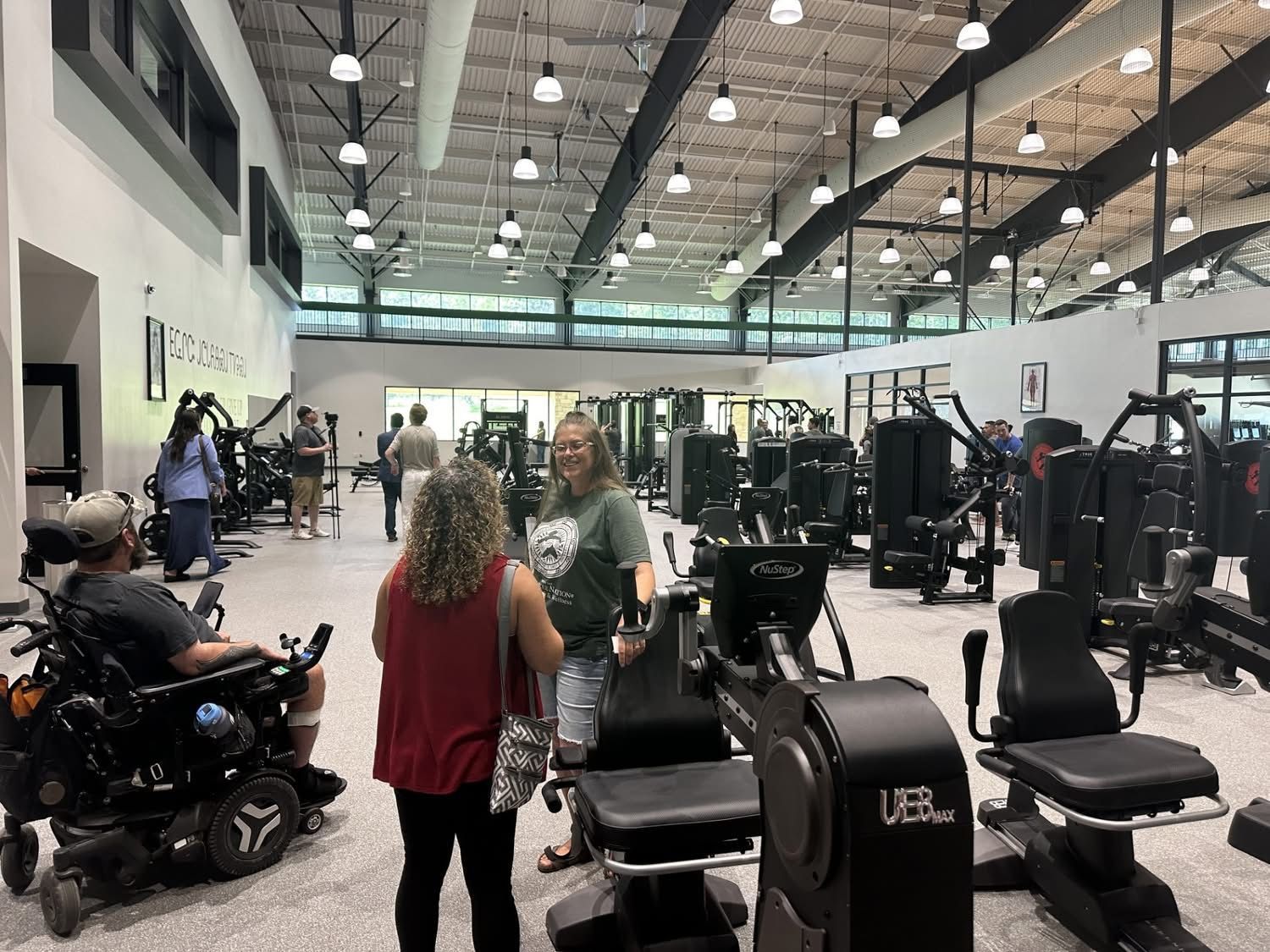 People Checking out the new equipment at Stilwell Wellness 