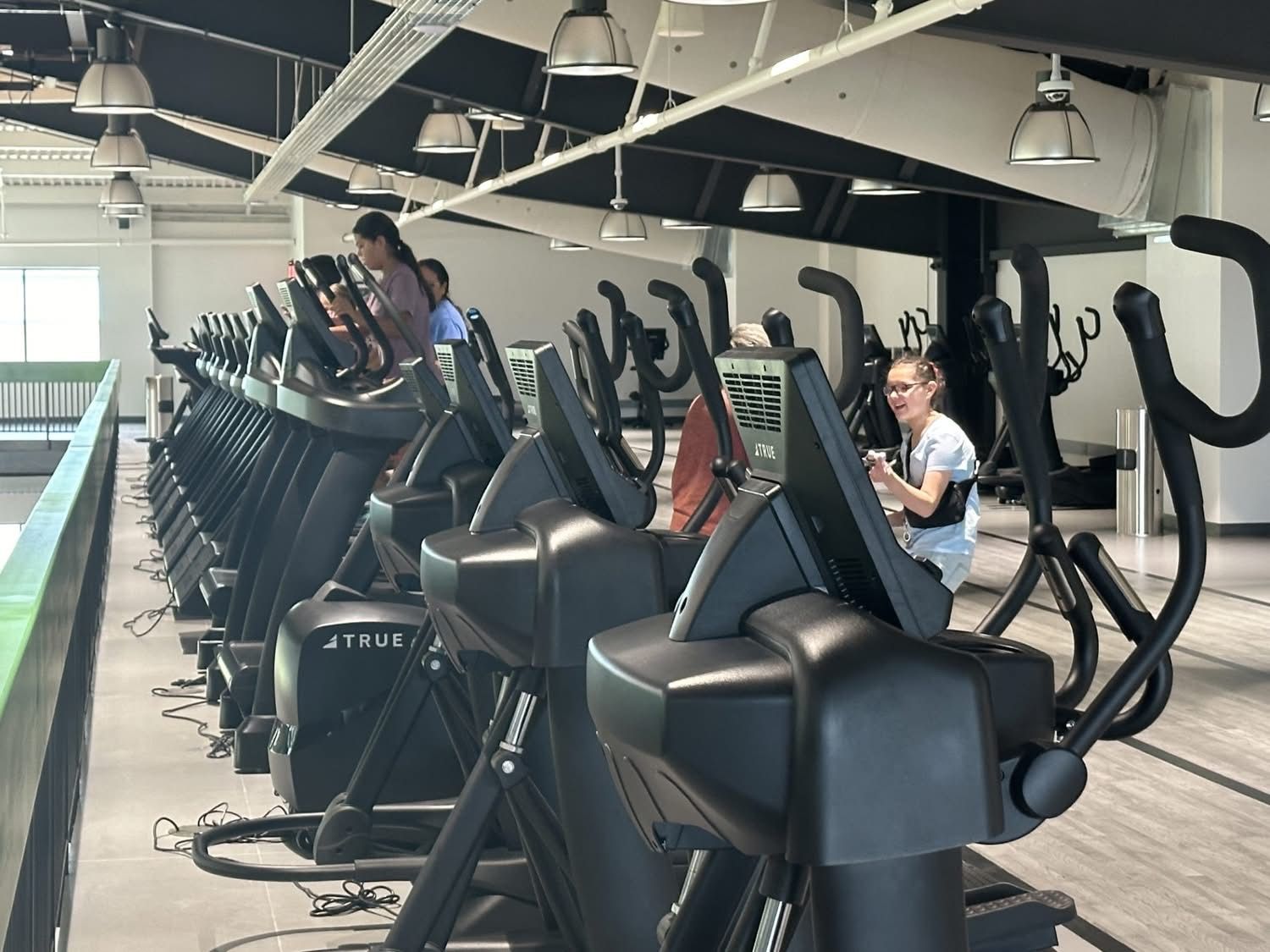 People Working out upstairs at The new Stilwell Wellness center