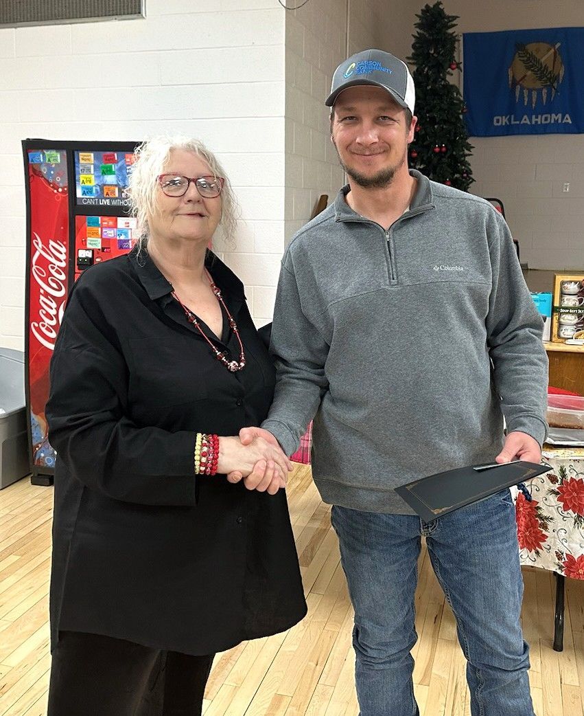 Jesse Akins receives recognition from Mayor Jean Ann Wright for his dedication to the City of Stilwell and citizens.