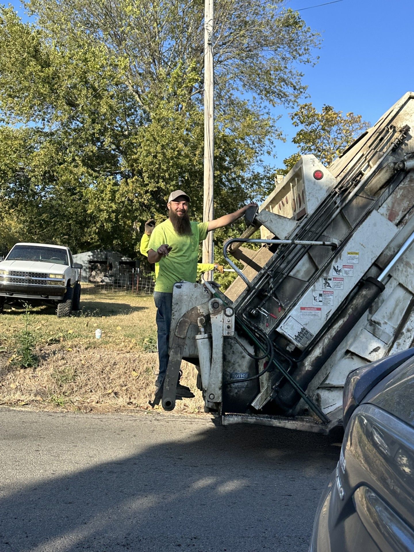 Jeremiah waves from the back of a truck