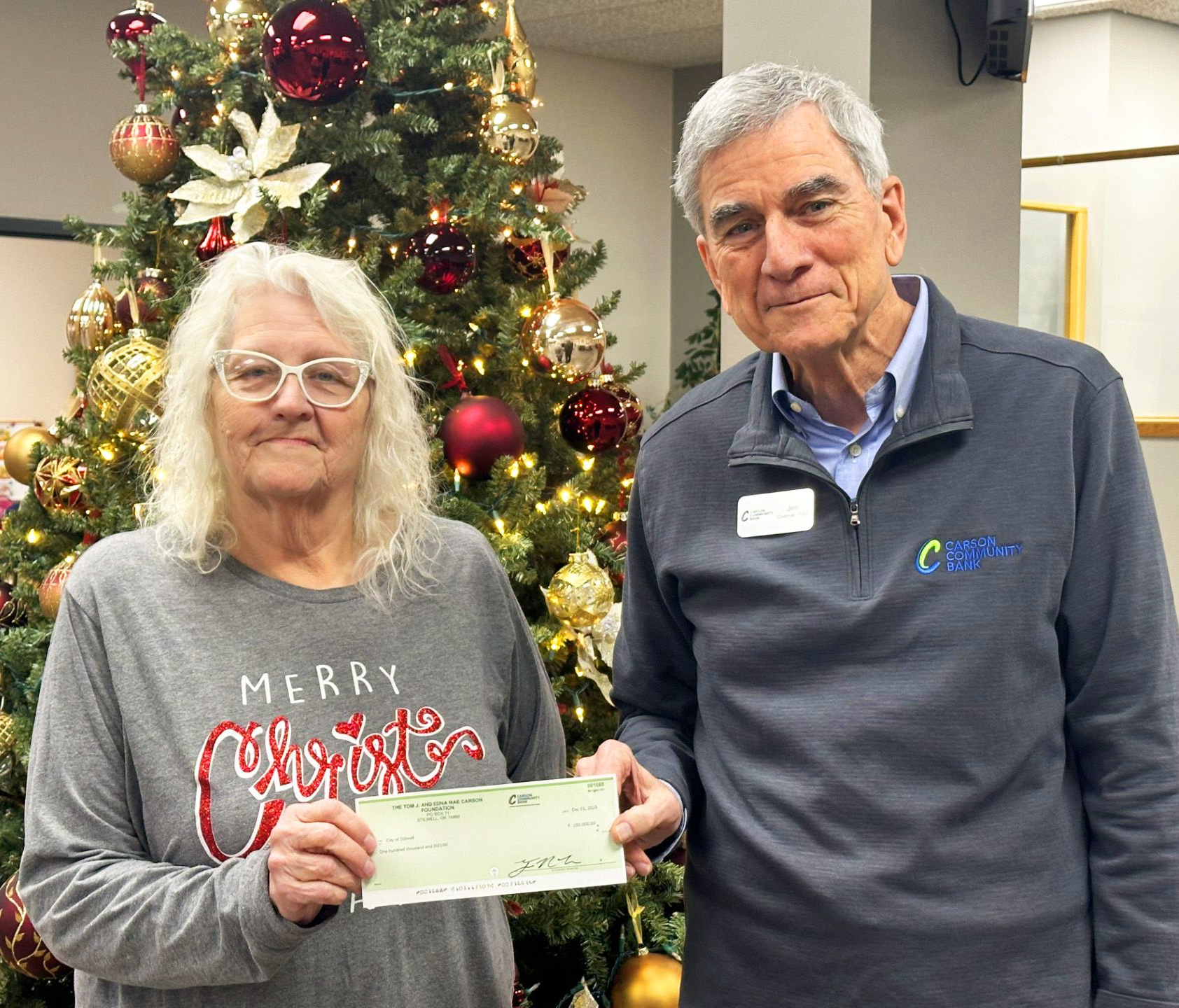 Jim Carson presents a check to Mayor Wright from the Carson Foundation for work at the golf course at Carson Park.