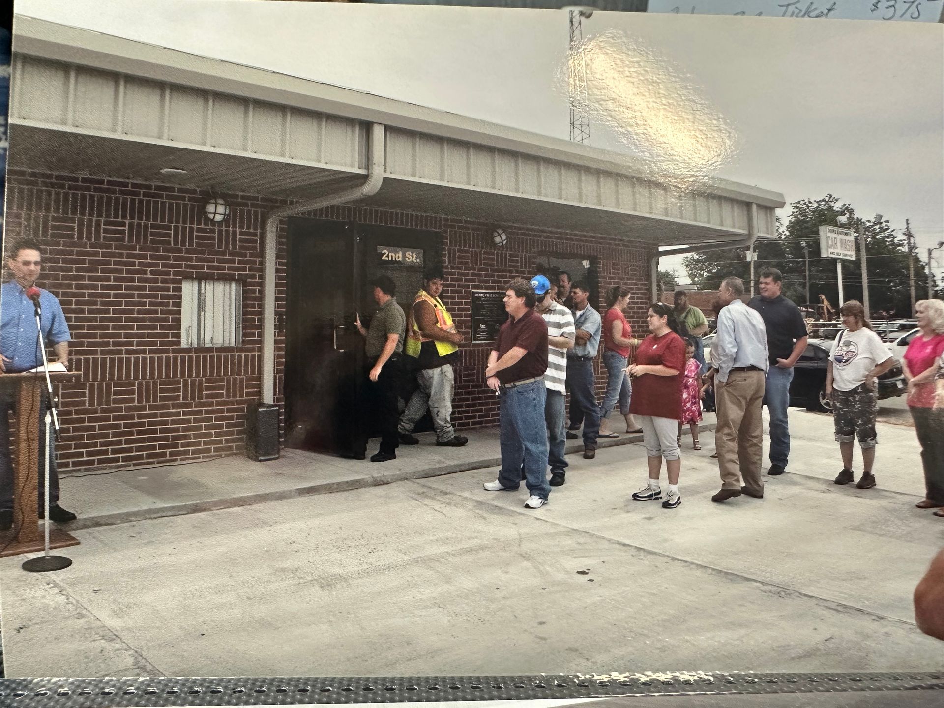 Stilwell citizens and police celebrating the police station opening