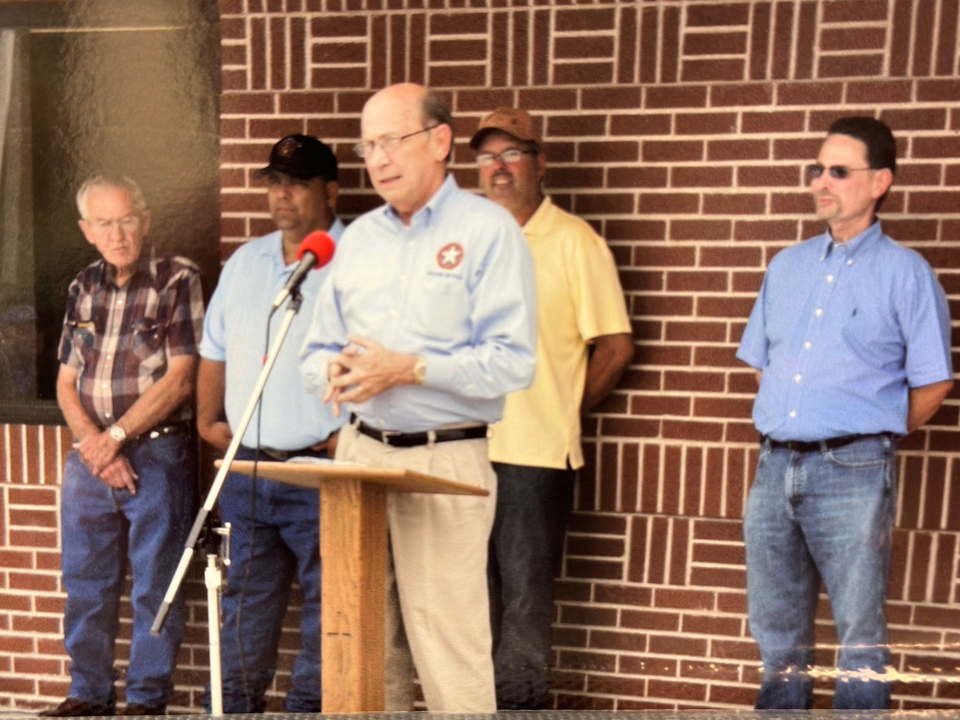 Officials speaking at the police station opening