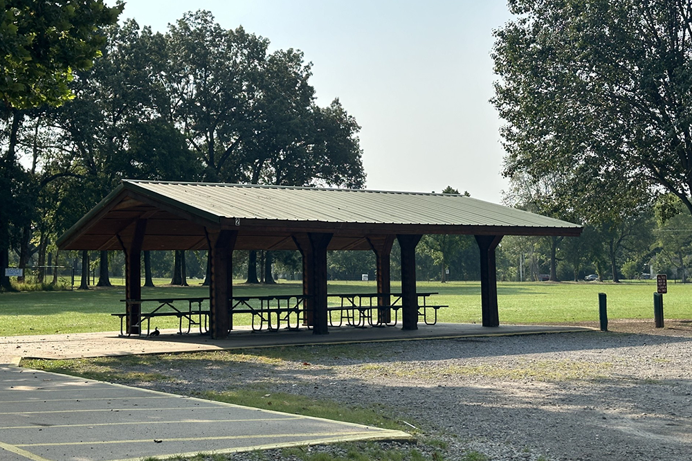 A picnic shelter with tables and benches in a park