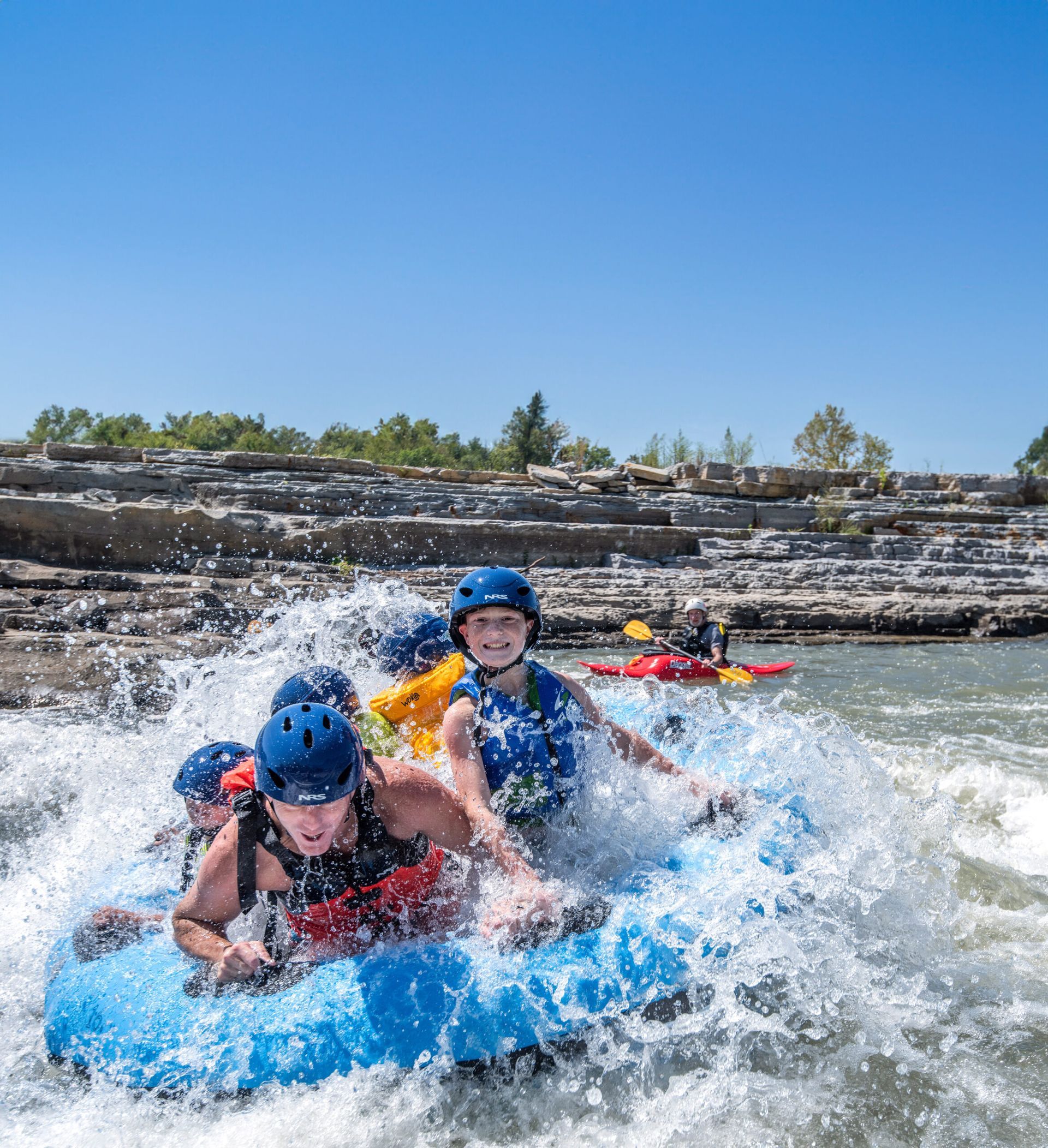 A group of people are rafting down a river.