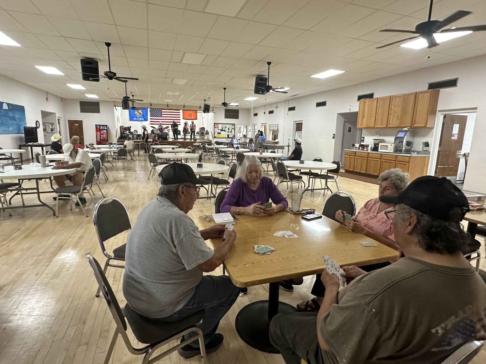 People playing cards. Clockwise from left are: George Bunch, Donna Merrie, Janus Muskrat and Roger Glass.