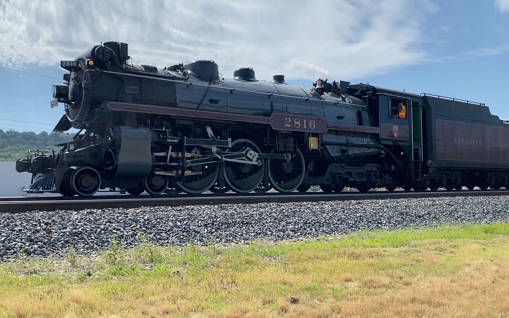 The train is shown stopped north of the Stilwell historic depot