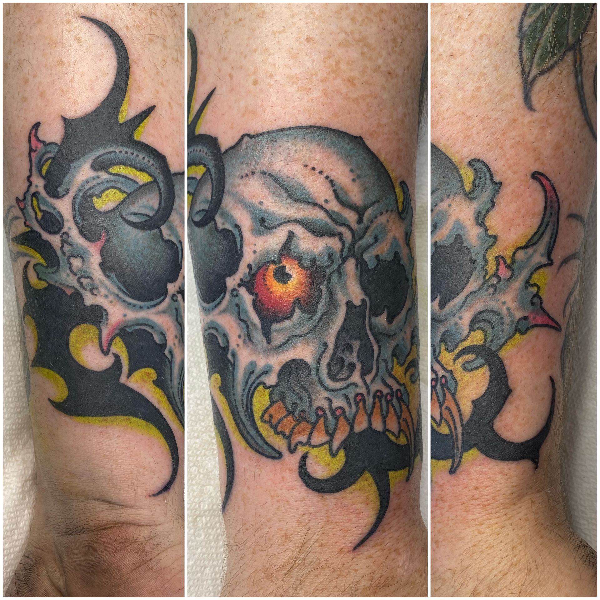 a man has a tattoo of a skull on his leg