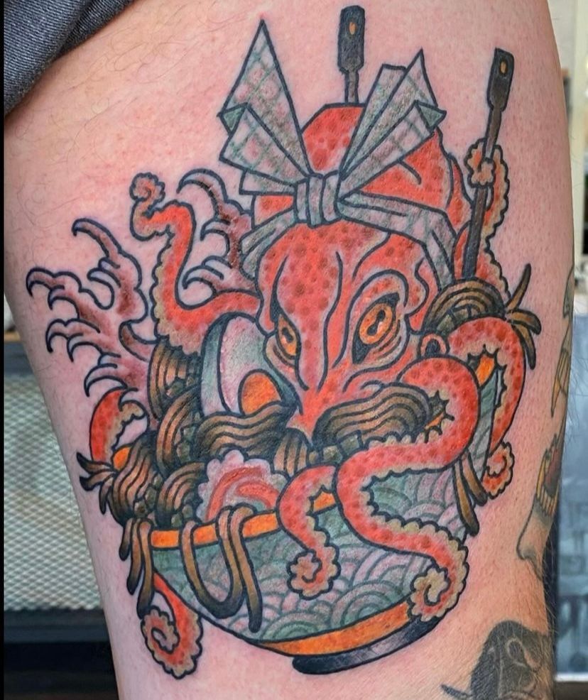 a tattoo of an octopus in a bowl of noodles