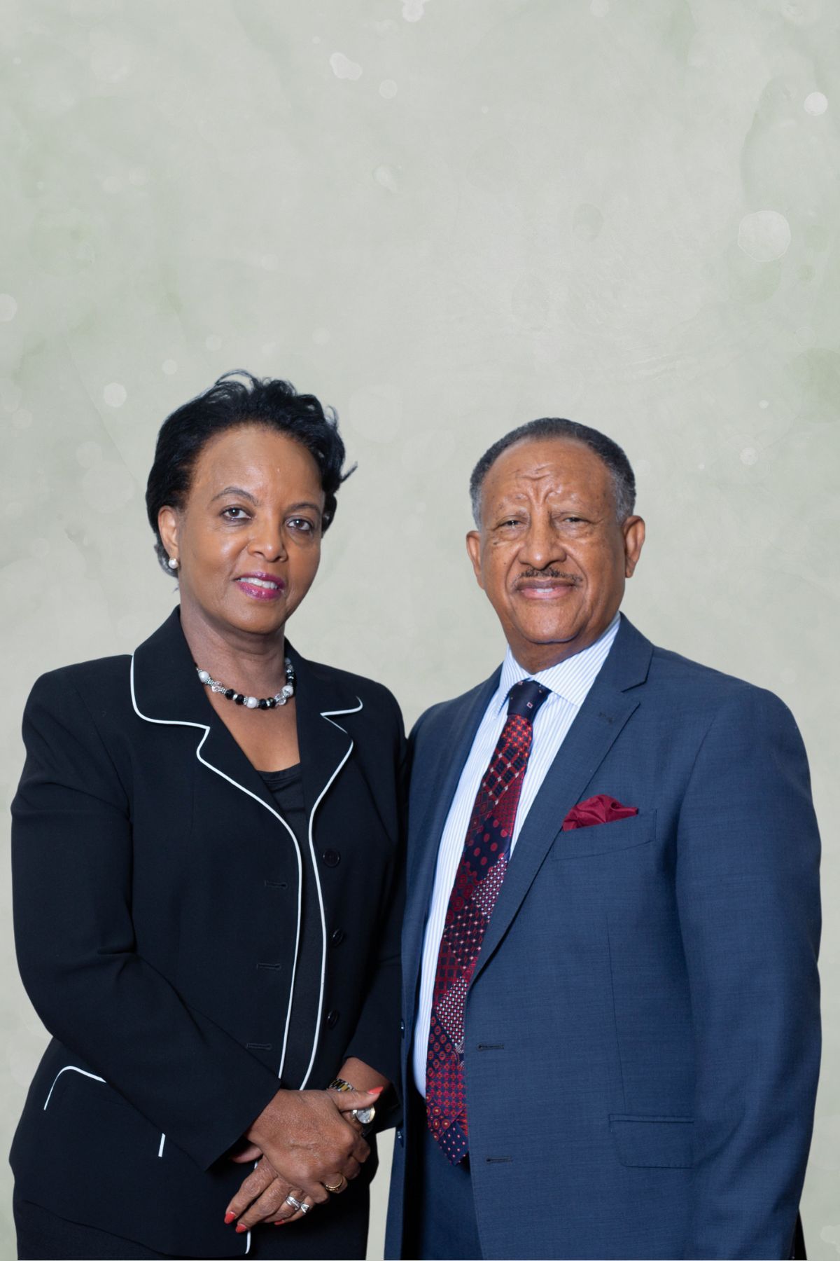 A man in a suit and tie is smiling for the camera.