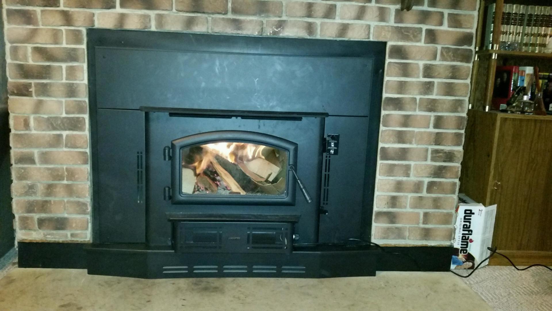 A fireplace with a wood stove built into it