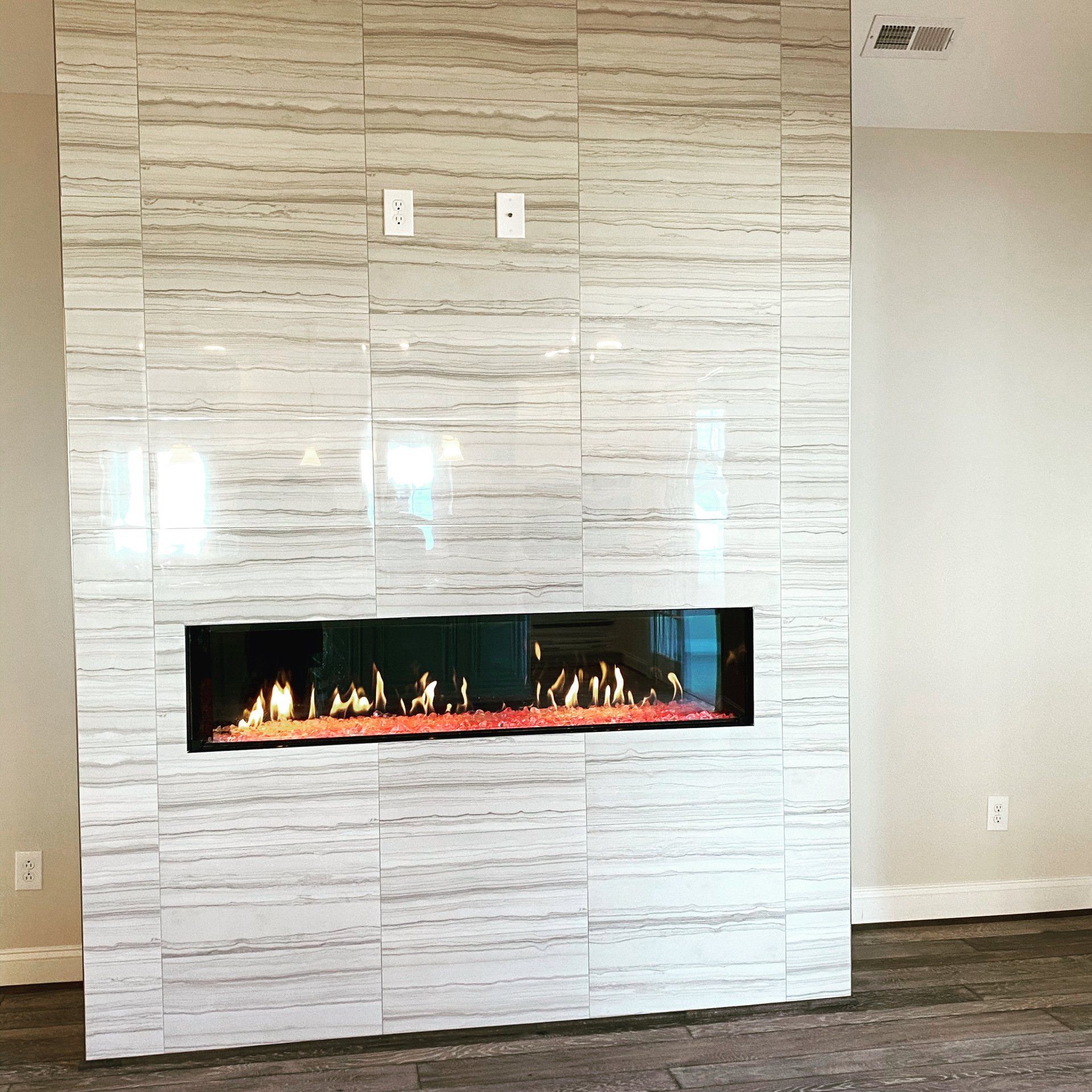 A fireplace is built into a wall in a living room.