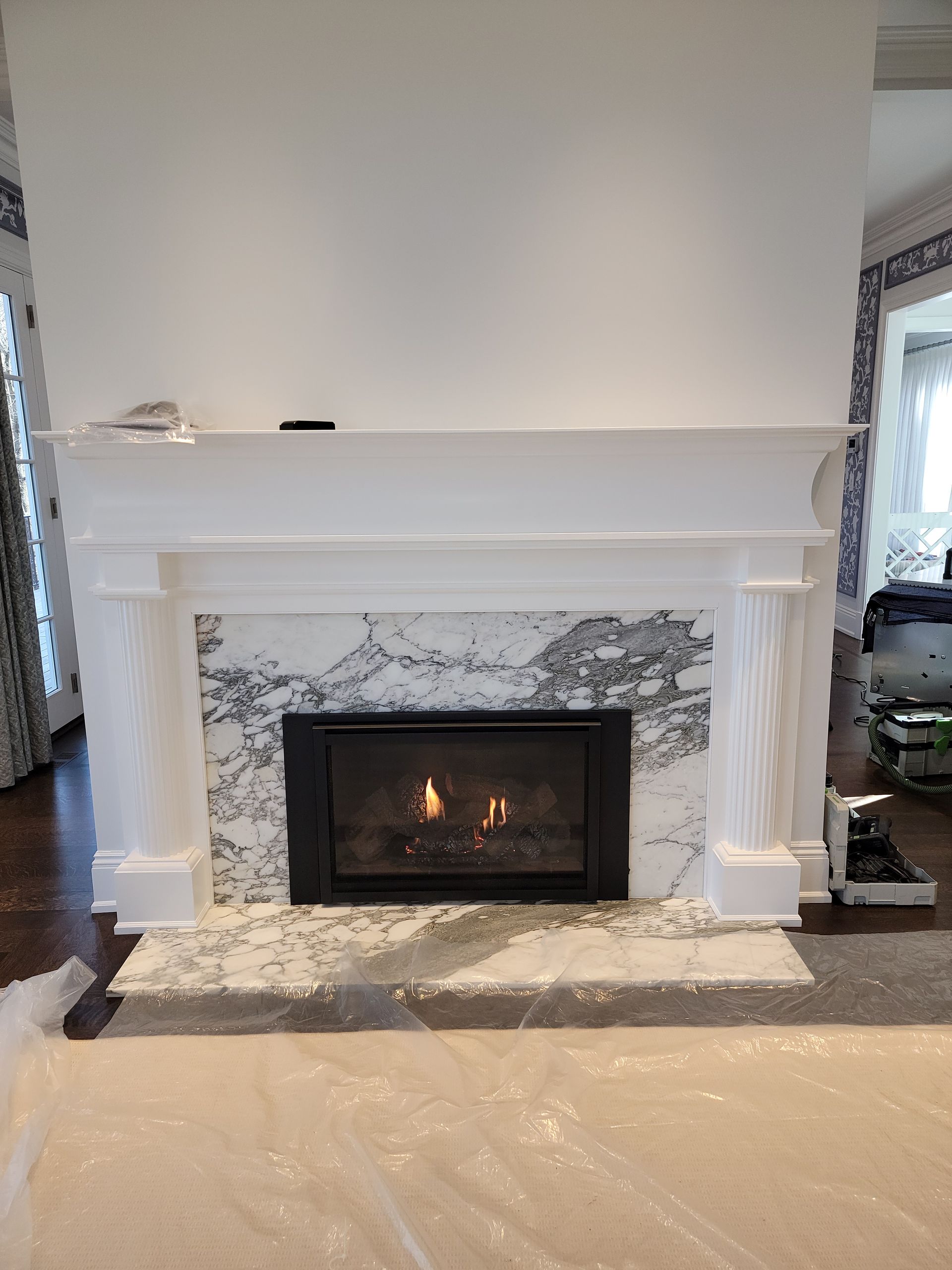 There is a fireplace in the middle of the room.