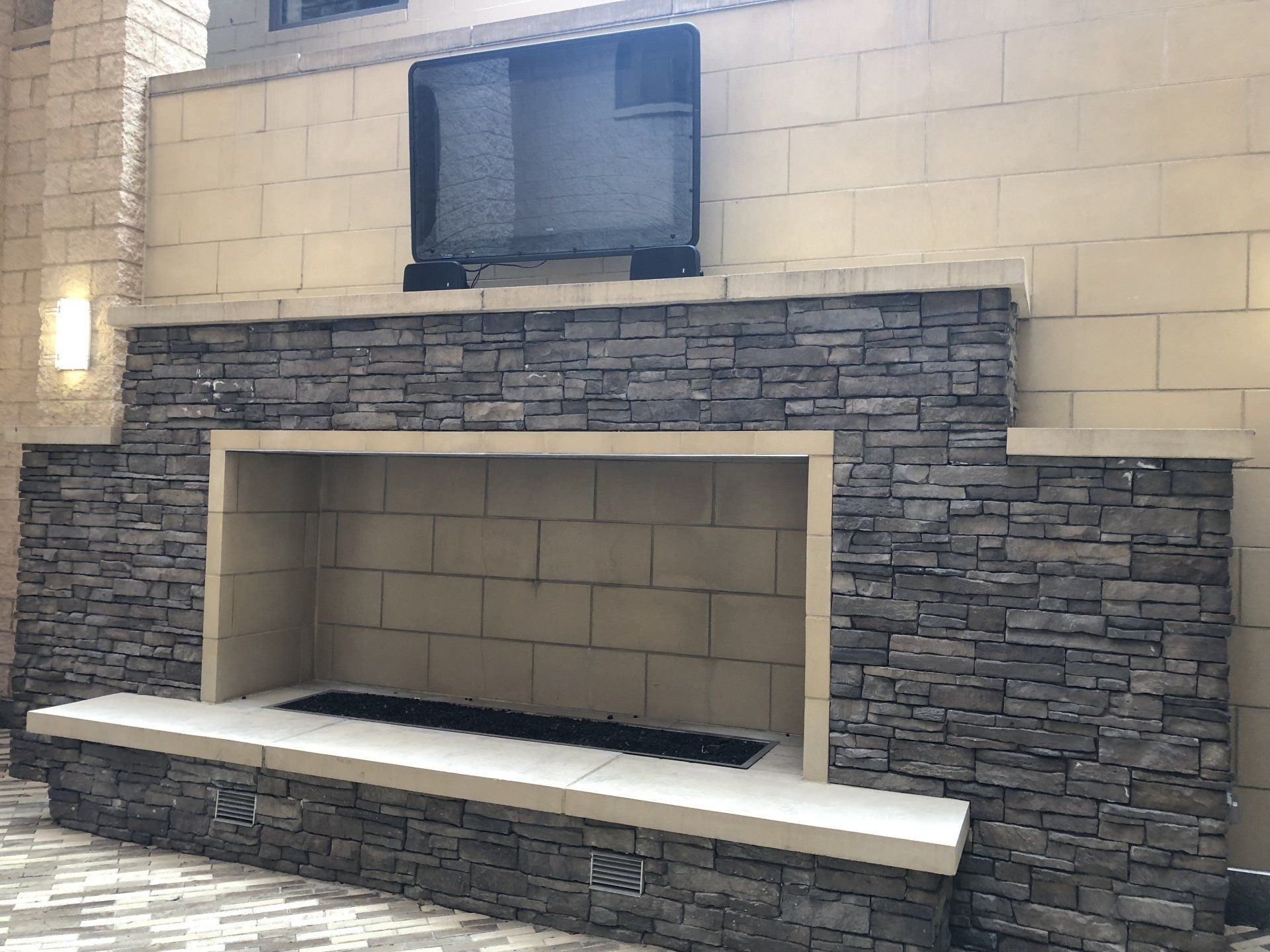 A fireplace with a flat screen tv above it