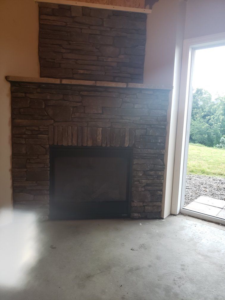 There is a fireplace in the middle of the room.