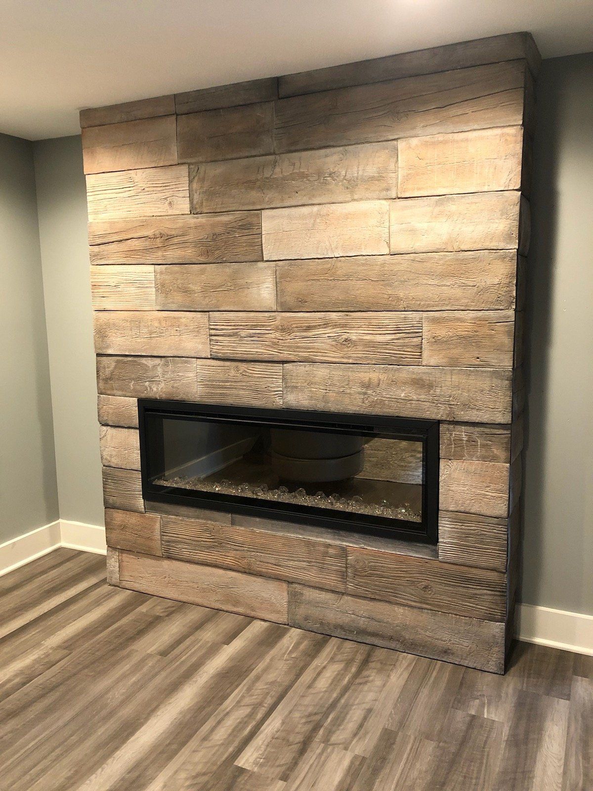 There is a fireplace in the middle of the room.