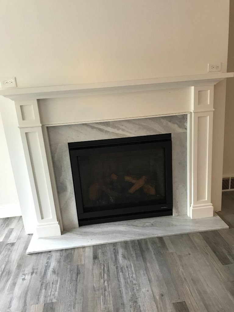There is a fireplace in the middle of the room.