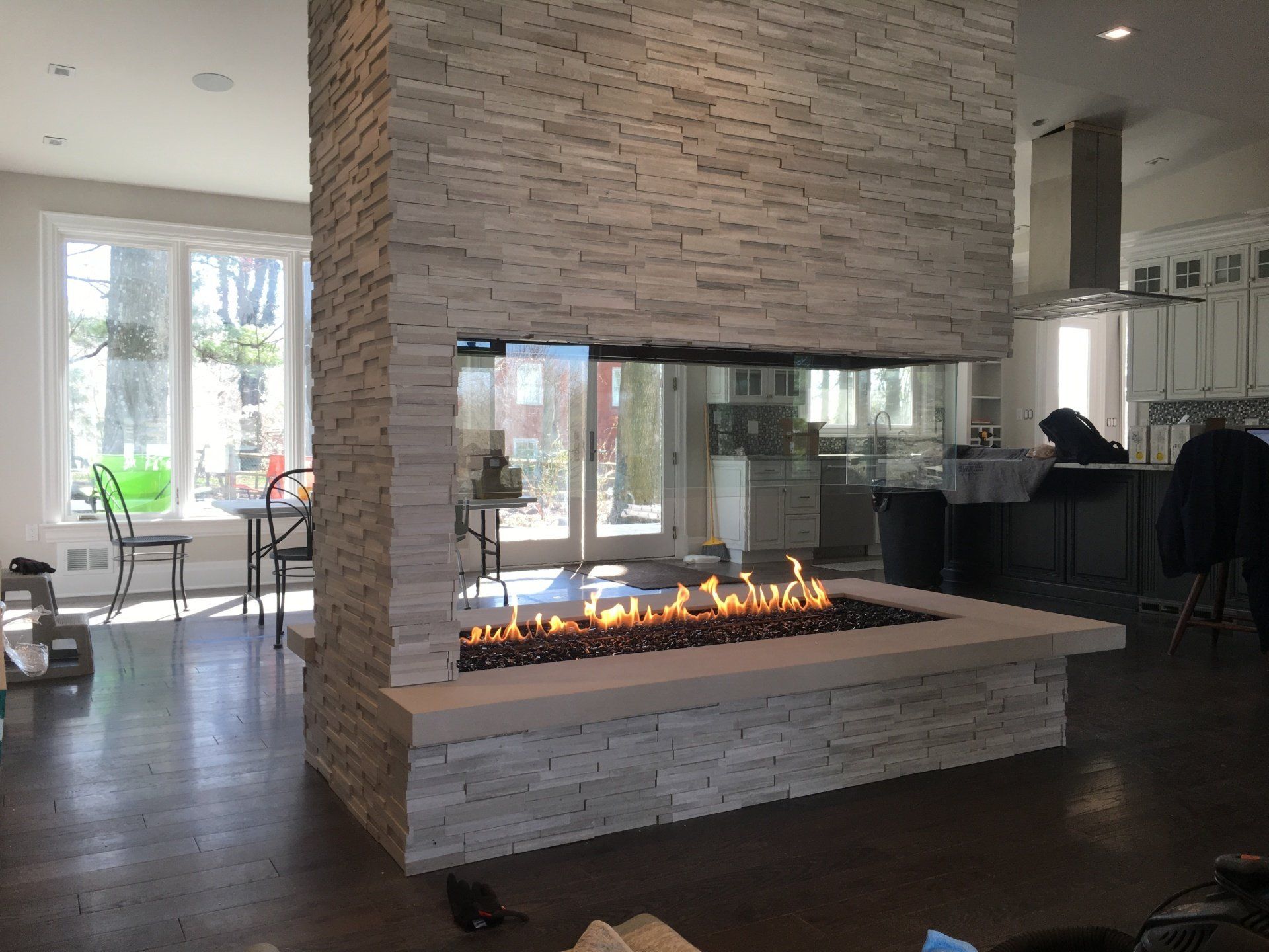 There is a fireplace in the middle of the room.