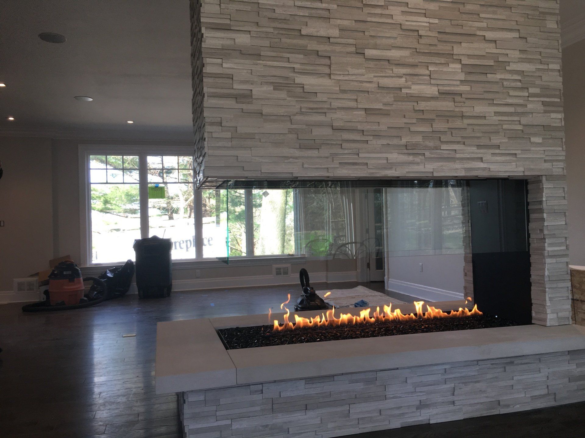 There is a fireplace in the middle of the room.