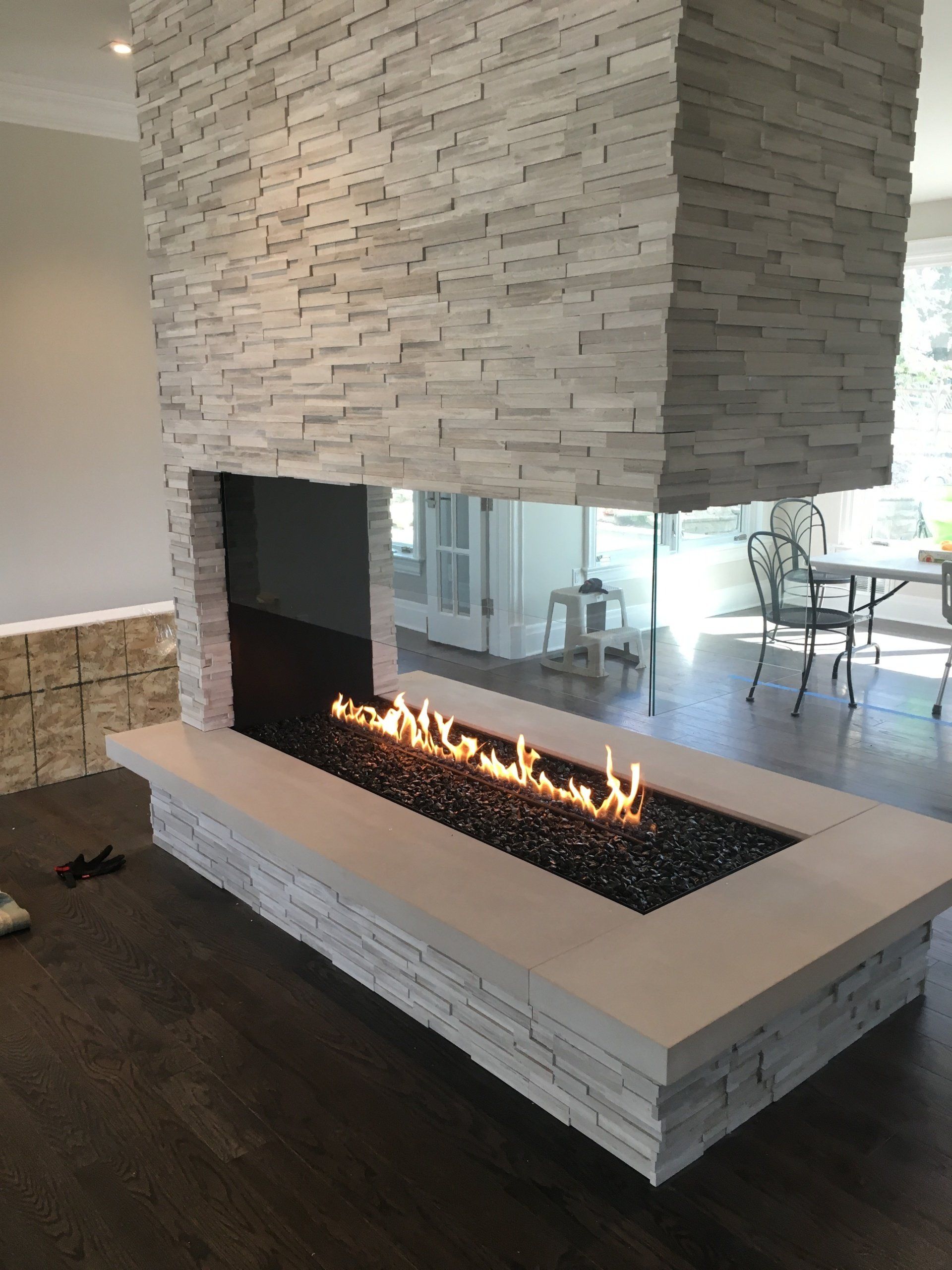 There is a fireplace in the middle of the room.