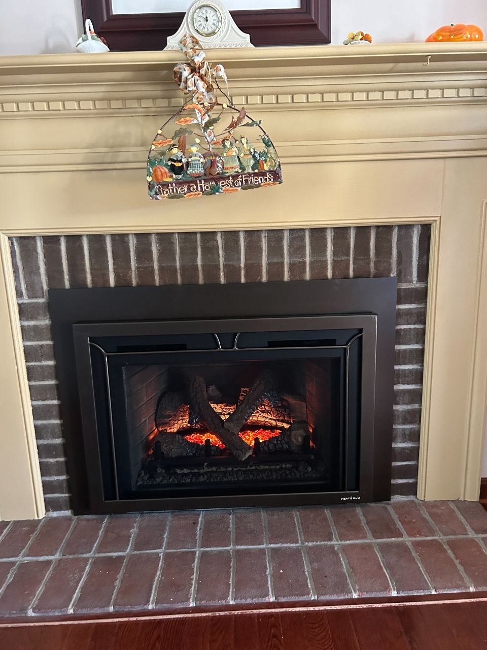 A fireplace with a clock on top of it