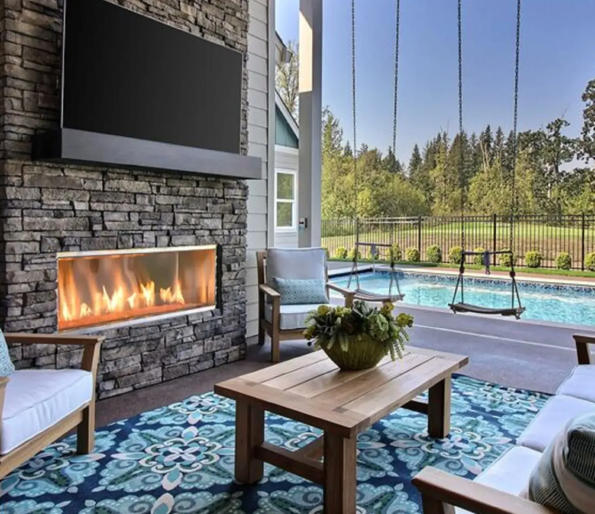 A living room with a fireplace and a flat screen tv
