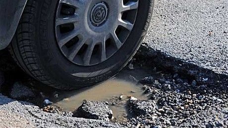 Tire hitting pothole for Tire Shop in Arlington, MA