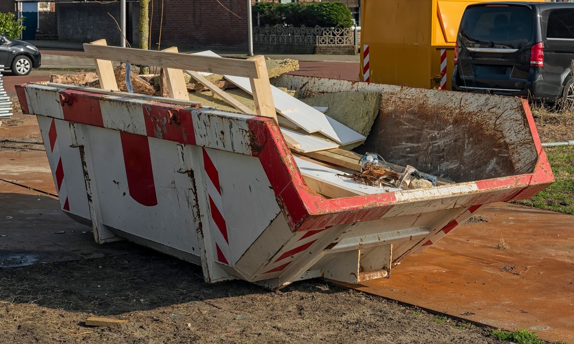 Dumpster filled with construction waste, showcasing reliable commercial dumpster rental.