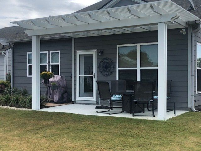 New pergola attached to side of house in Wilmington, NC