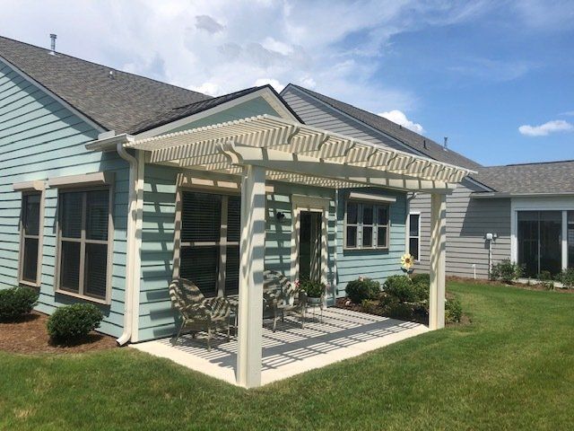 Stunning pergola installation over concrete patio