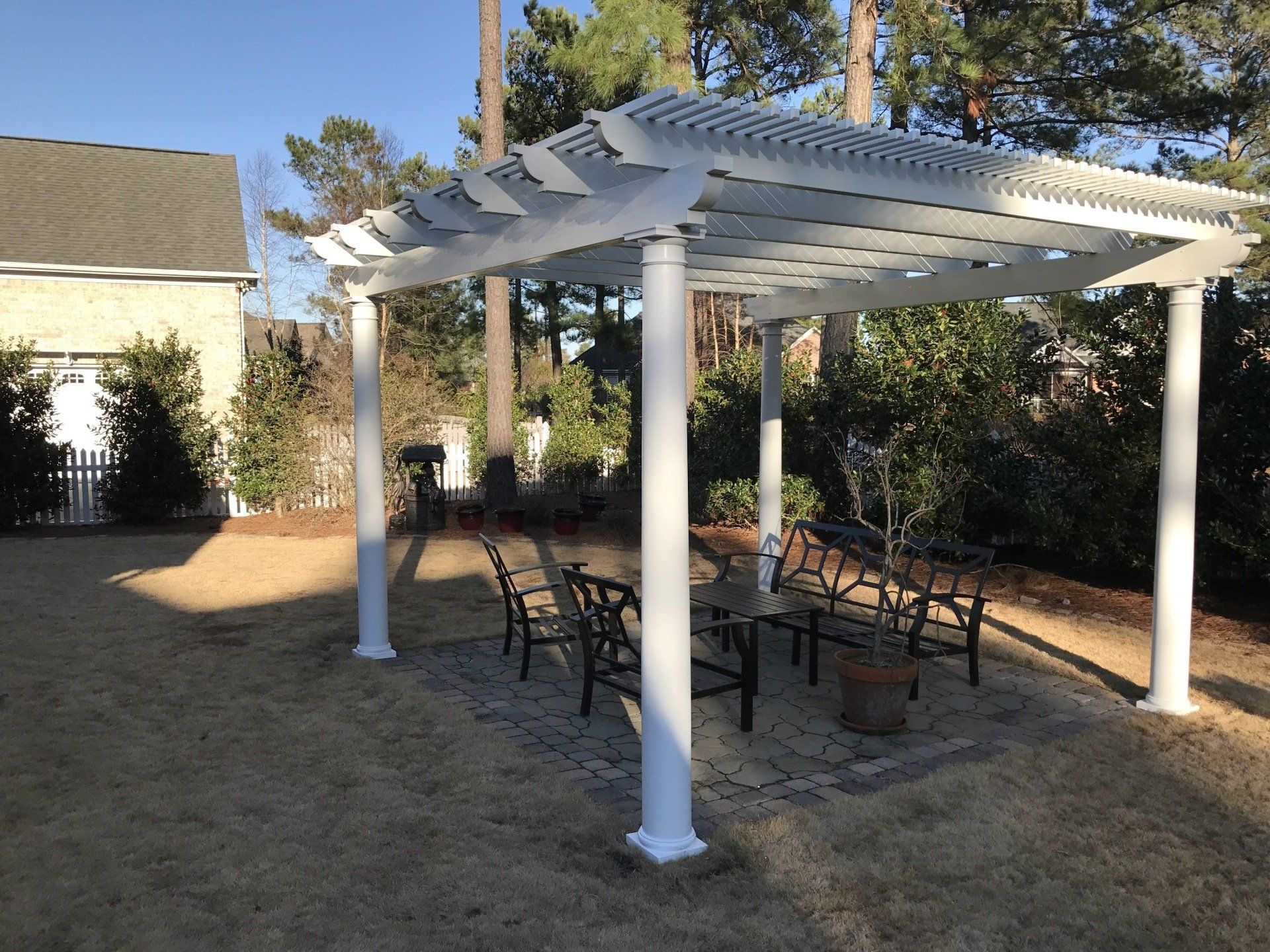 Pergola installation over outdoor seating area