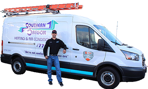 A man is standing in front of a white van with a ladder on top of it. A man is standing in front of a white van with a ladder on top of it.