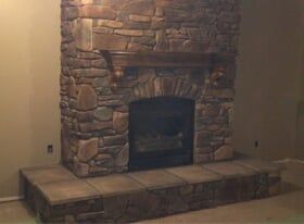 Stone Fireplace with Wooden Mantelpiece