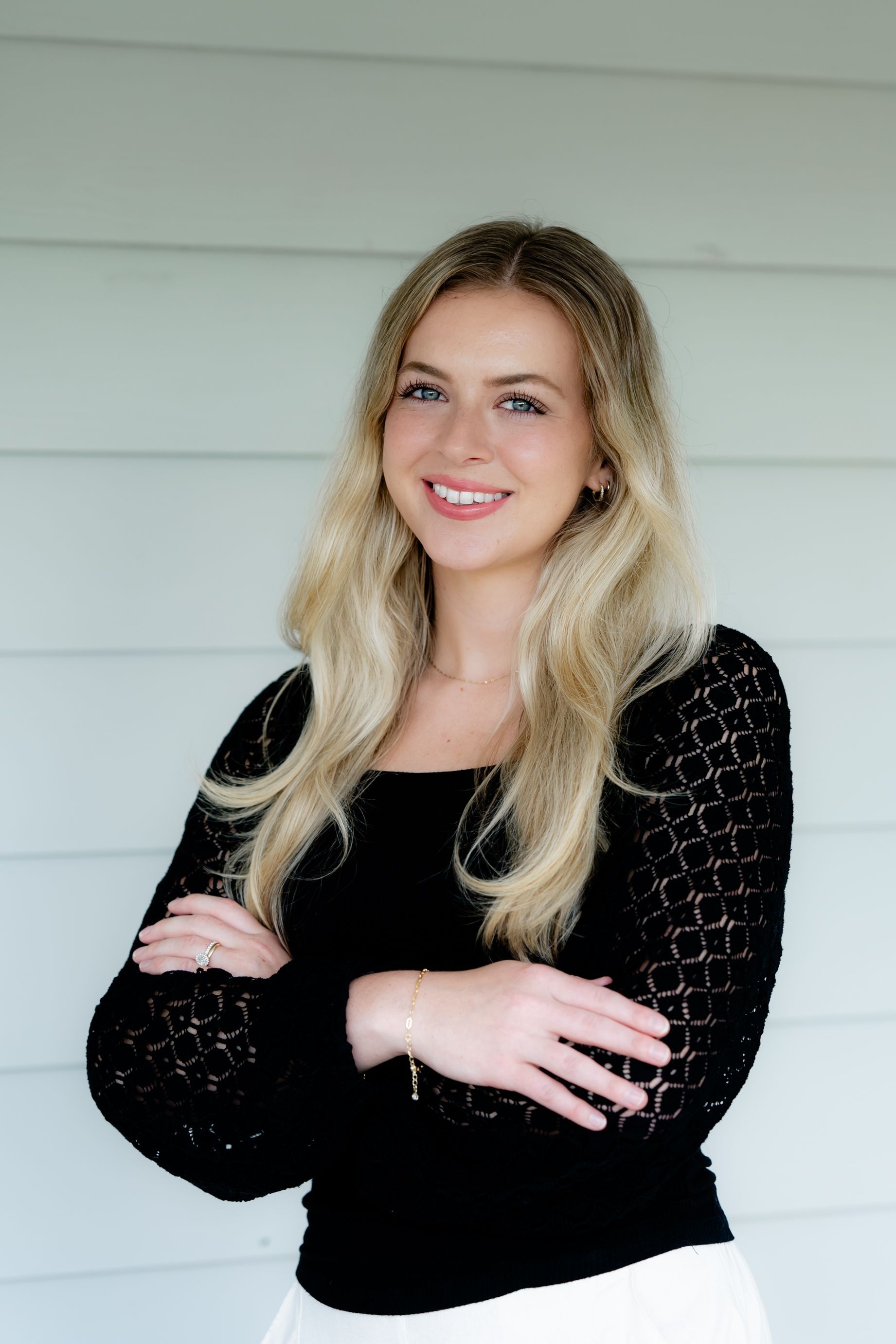 A man with a beard is sitting at a bar.