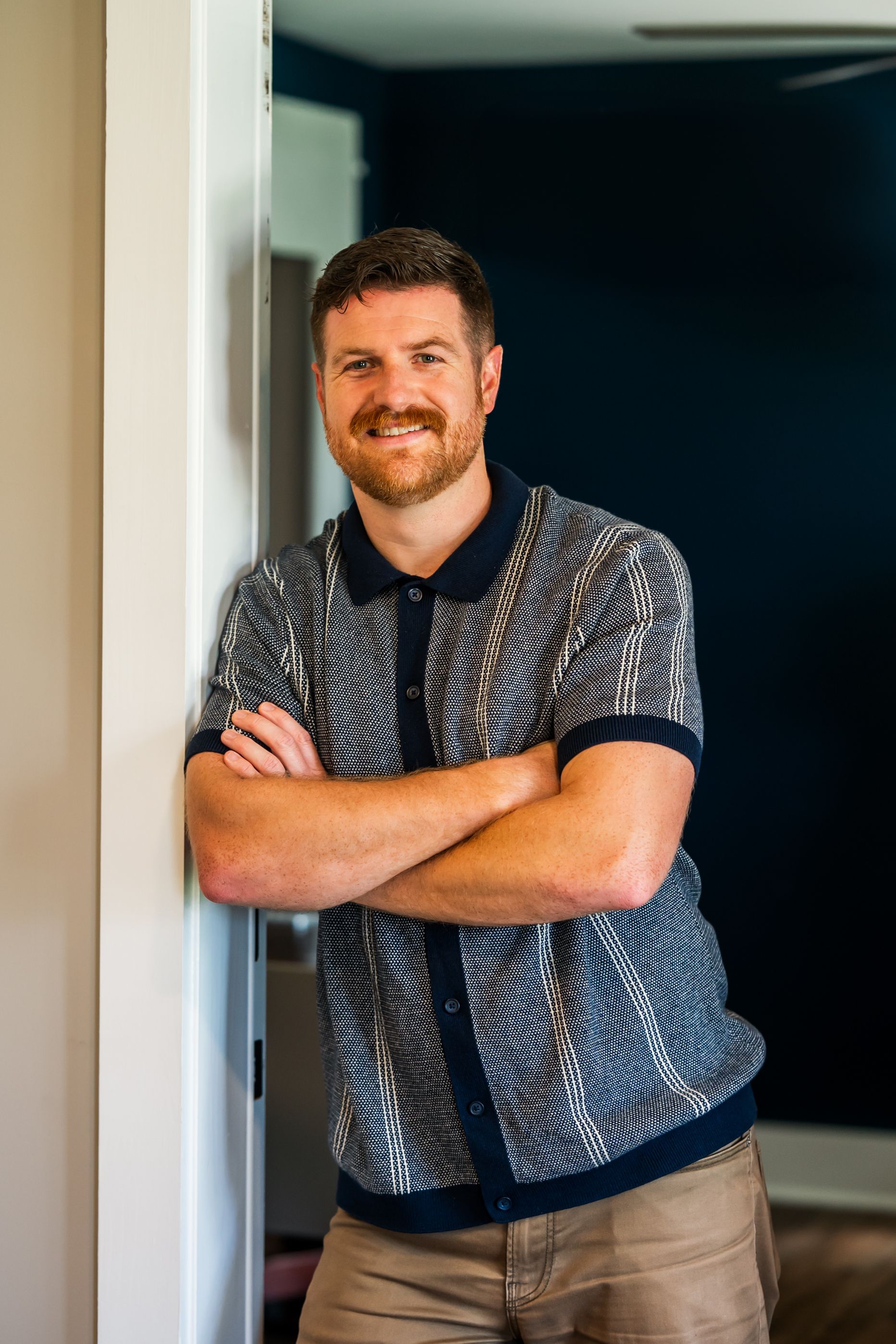 A man with a beard wearing a suit and tie