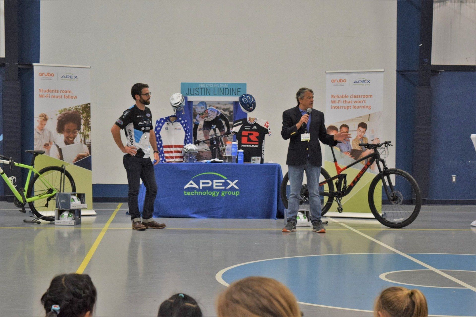 Professional Cyclist, Justin Lindine, and CEO, Christopher Dale, are  pictured here at Apex Technology Group's Client Appreciation: Cycle Safety Event. 