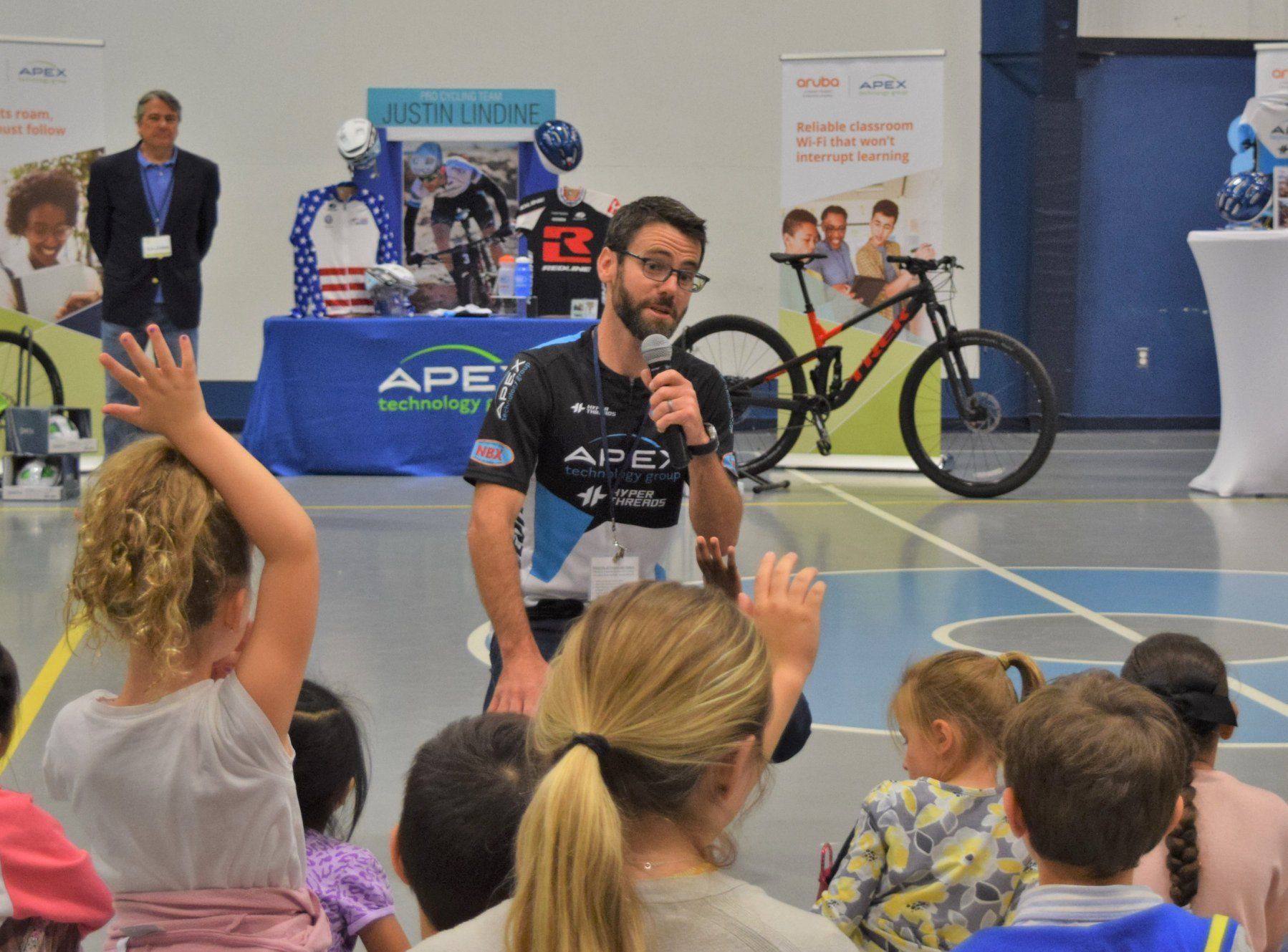 Professional Cyclist, Justin Lindine, is  pictured here at Apex Technology Group's Client Appreciation: Cycle Safety Event. 